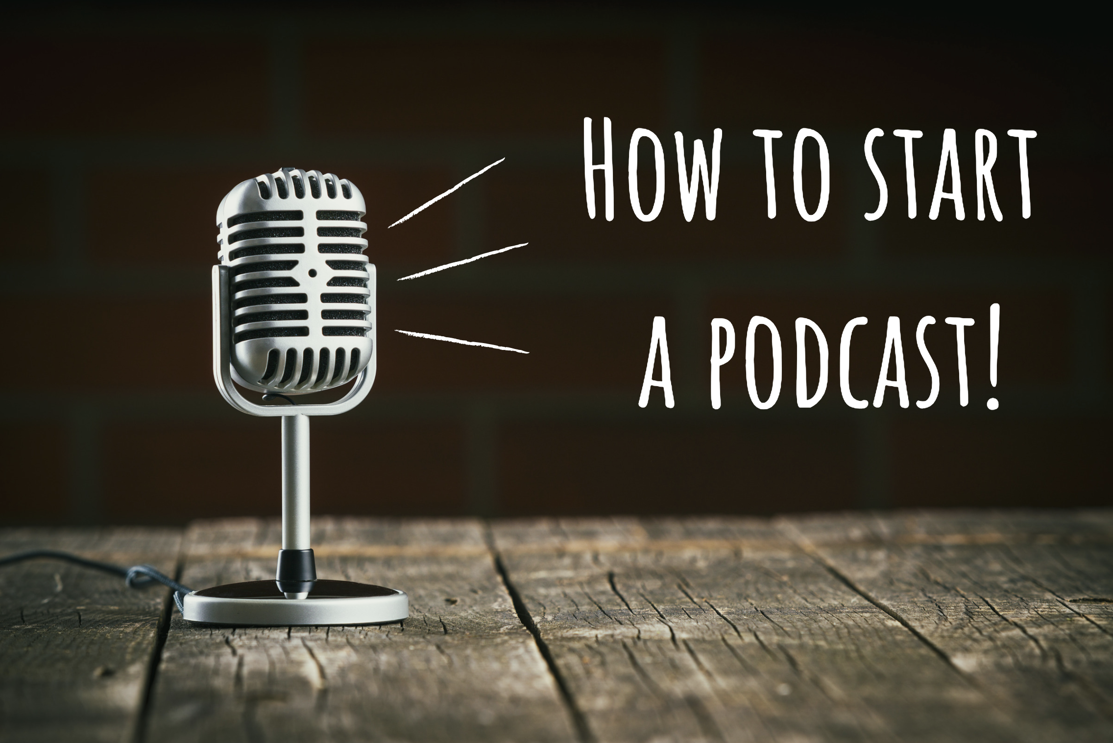 Silver stand up microphone on a wood table with text, "How to start a podcast!"